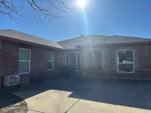 a kitchen with granite countertop a sink and a stove