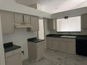 a view of kitchen with furniture and a fireplace