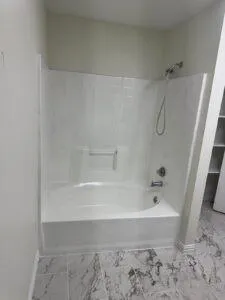 an empty room with a ceiling fan