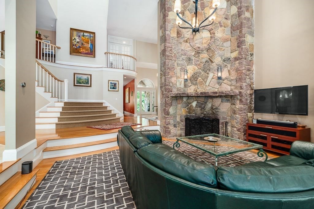 30 Autumn Lane Hamilton, MA 01982 - Photo 13 of 42 a living room with furniture and a flat screen tv