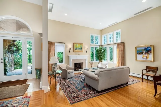 a living room with furniture and a fireplace