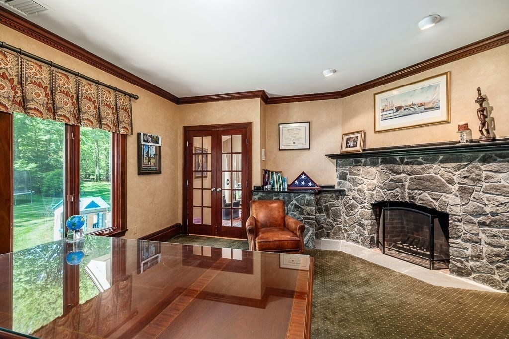 30 Autumn Lane Hamilton, MA 01982 - Photo 20 of 42 a living room with furniture and a fireplace