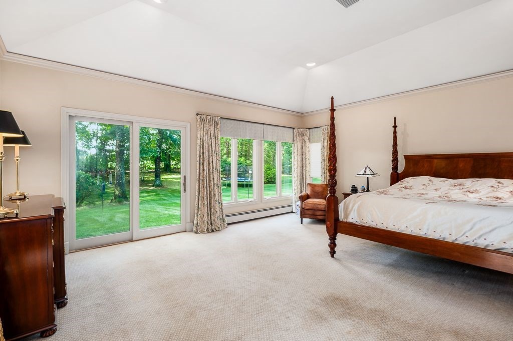 30 Autumn Lane Hamilton, MA 01982 - Photo 22 of 42 a bedroom with a bed and a night stand