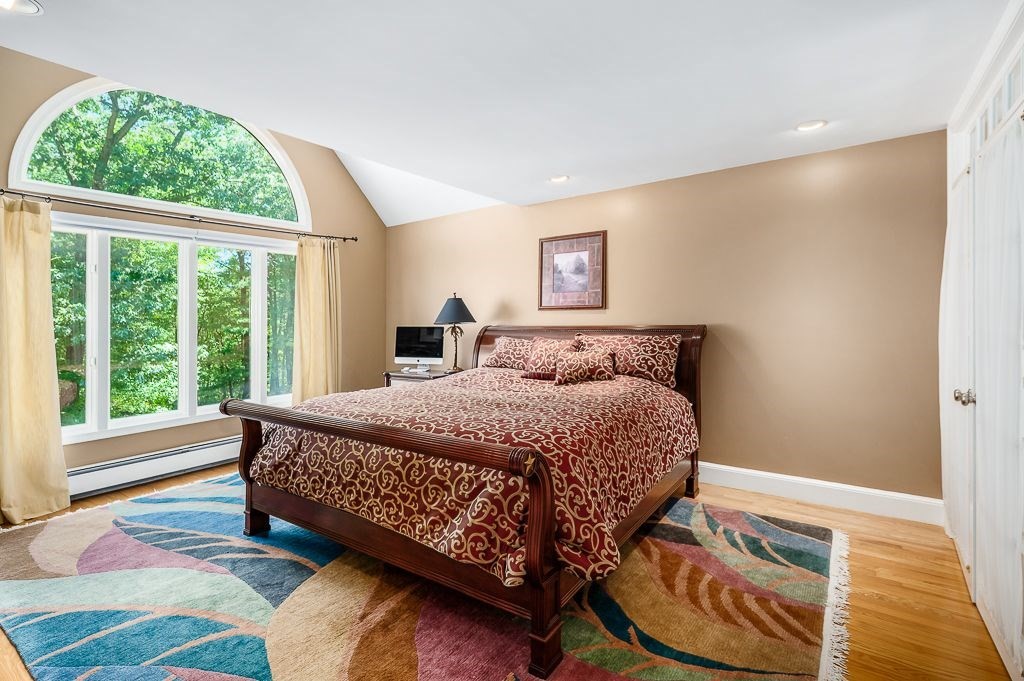 30 Autumn Lane Hamilton, MA 01982 - Photo 25 of 42 a bed sitting in a bedroom next to a window