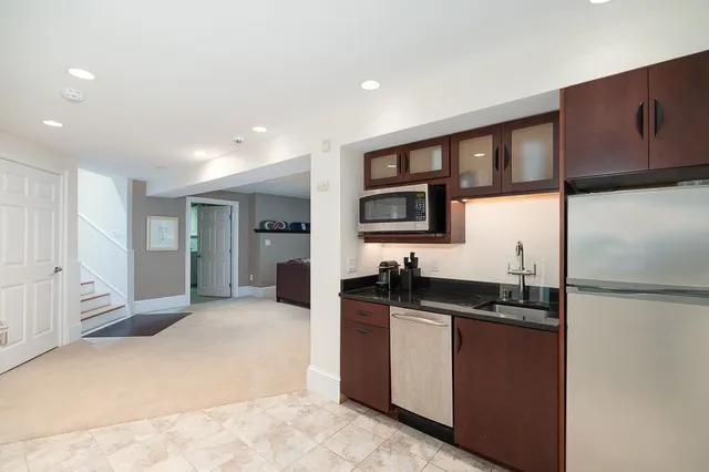 a kitchen with a sink and cabinets