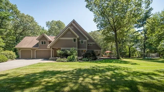 a front view of a house with a yard