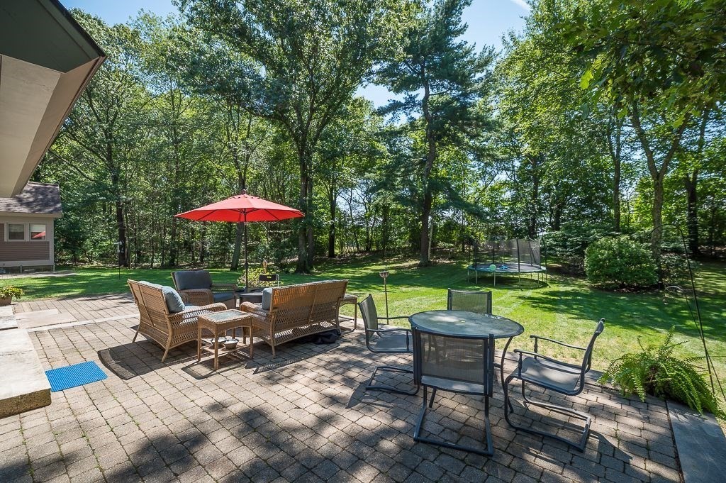 30 Autumn Lane Hamilton, MA 01982 - Photo 39 of 42 a backyard of a house with outdoor seating