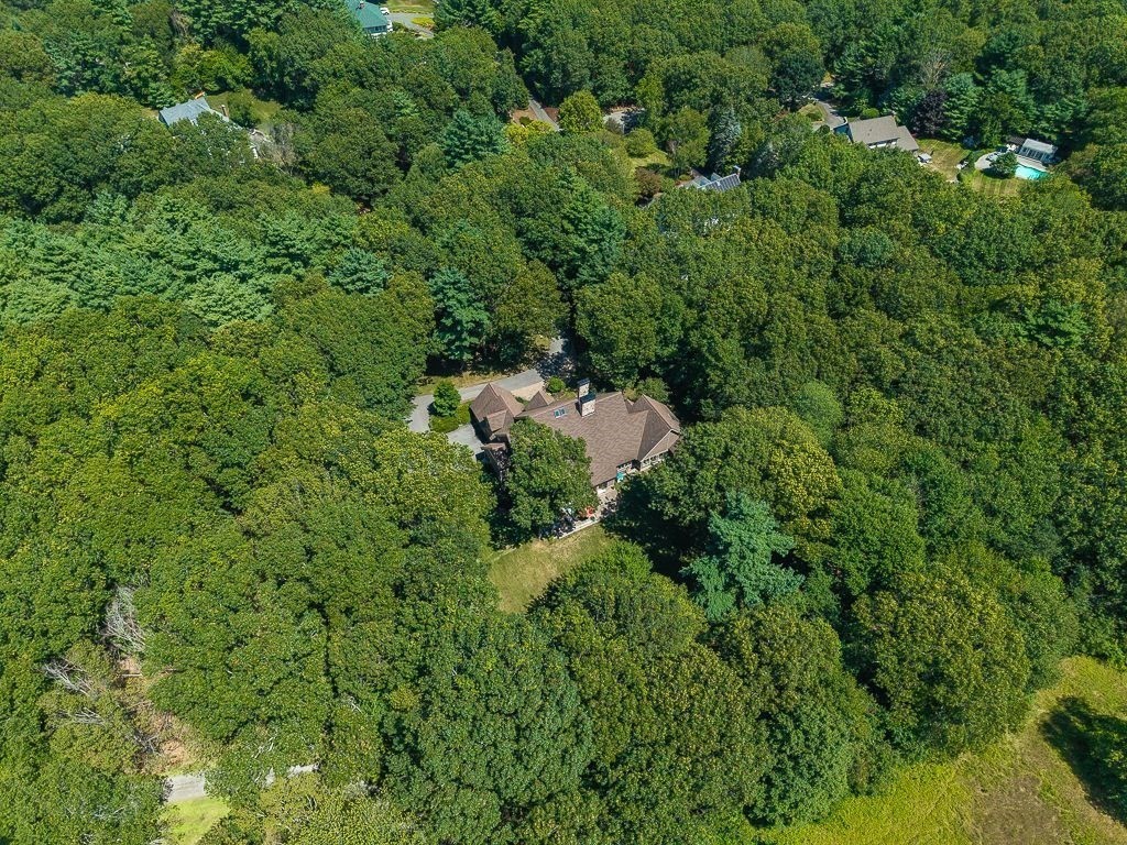 30 Autumn Lane Hamilton, MA 01982 - Photo 41 of 42 a view of a house with a lush green forest