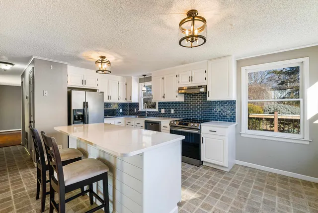 a view of a door and a window in an empty room