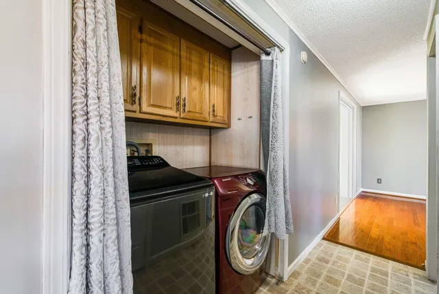 a view of a big room with windows