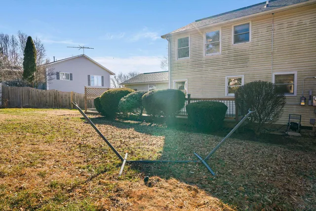 an aerial view of residential houses with outdoor space and river
