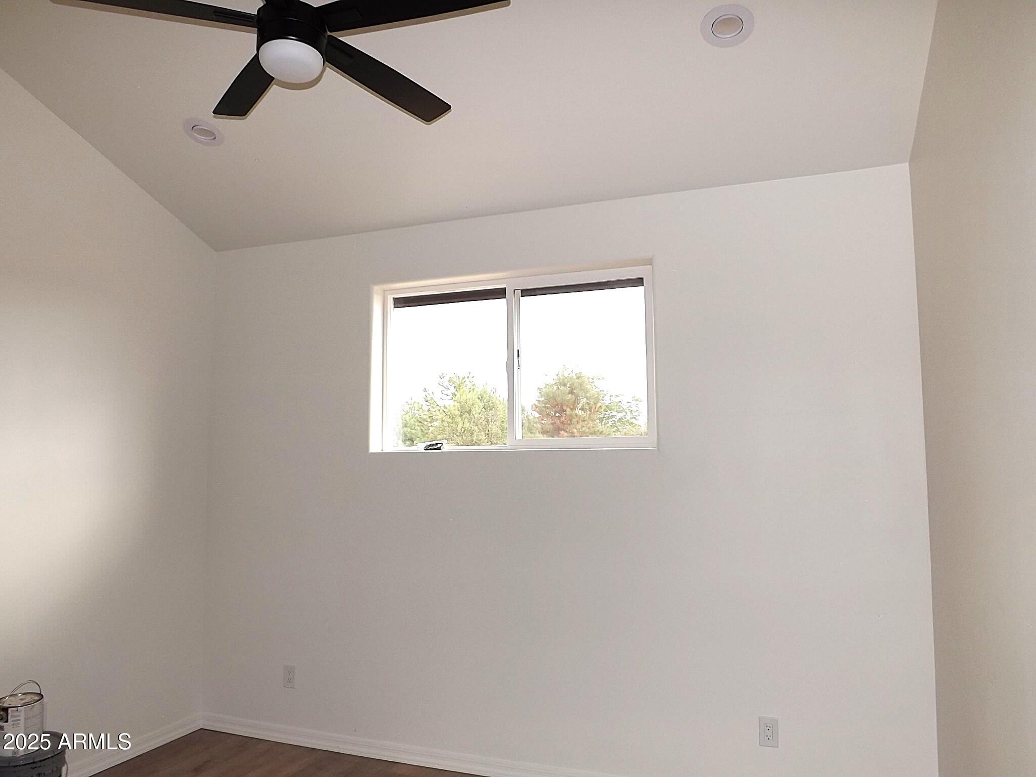 2763 Sunflower Drive Overgaard, AZ 85933 - Photo 11 of 18 an empty room with a window