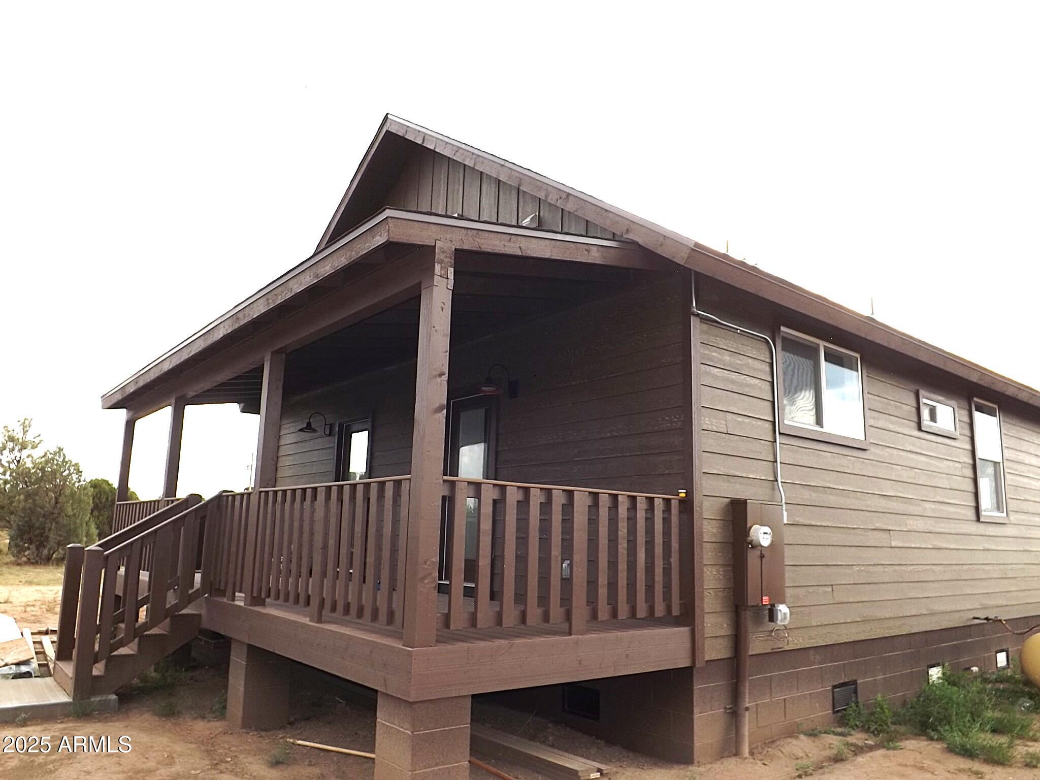 2763 Sunflower Drive Overgaard, AZ 85933 - Photo 4 of 18 a view of a house with a deck