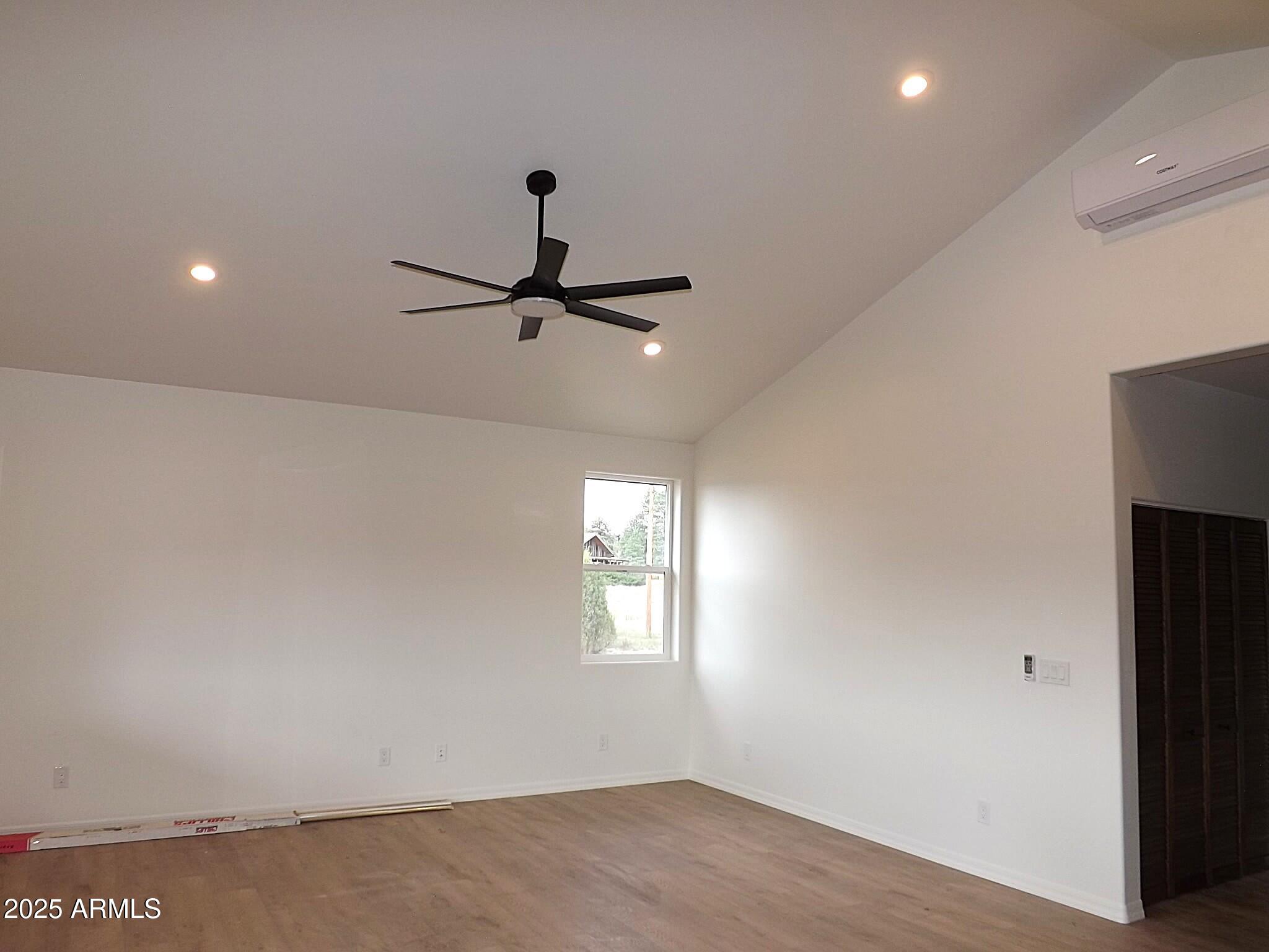 2763 Sunflower Drive Overgaard, AZ 85933 - Photo 7 of 18 a view of a room with a ceiling fan and hardwood floor