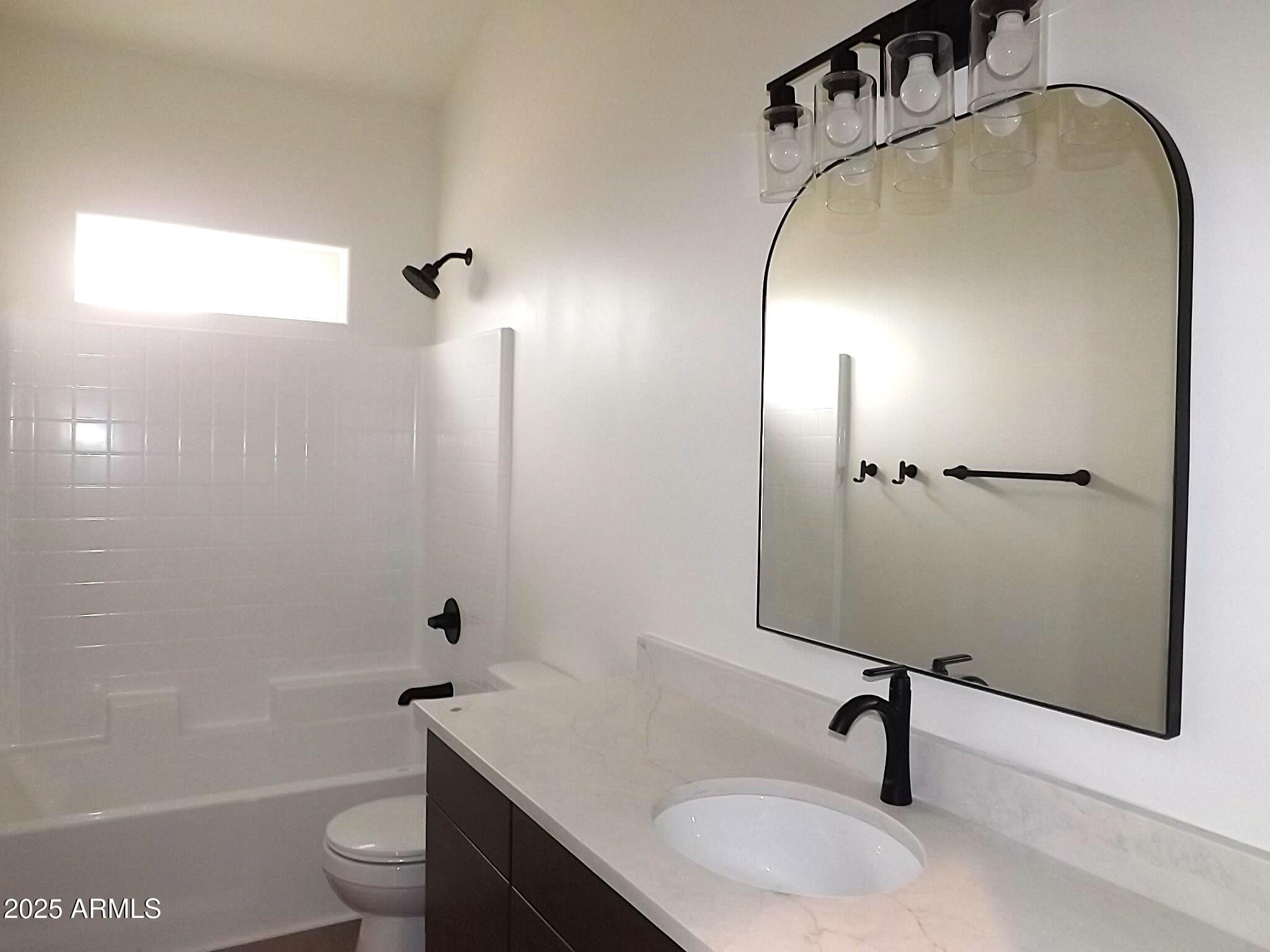 2763 Sunflower Drive Overgaard, AZ 85933 - Photo 10 of 18 a bathroom with a sink a toilet and shower