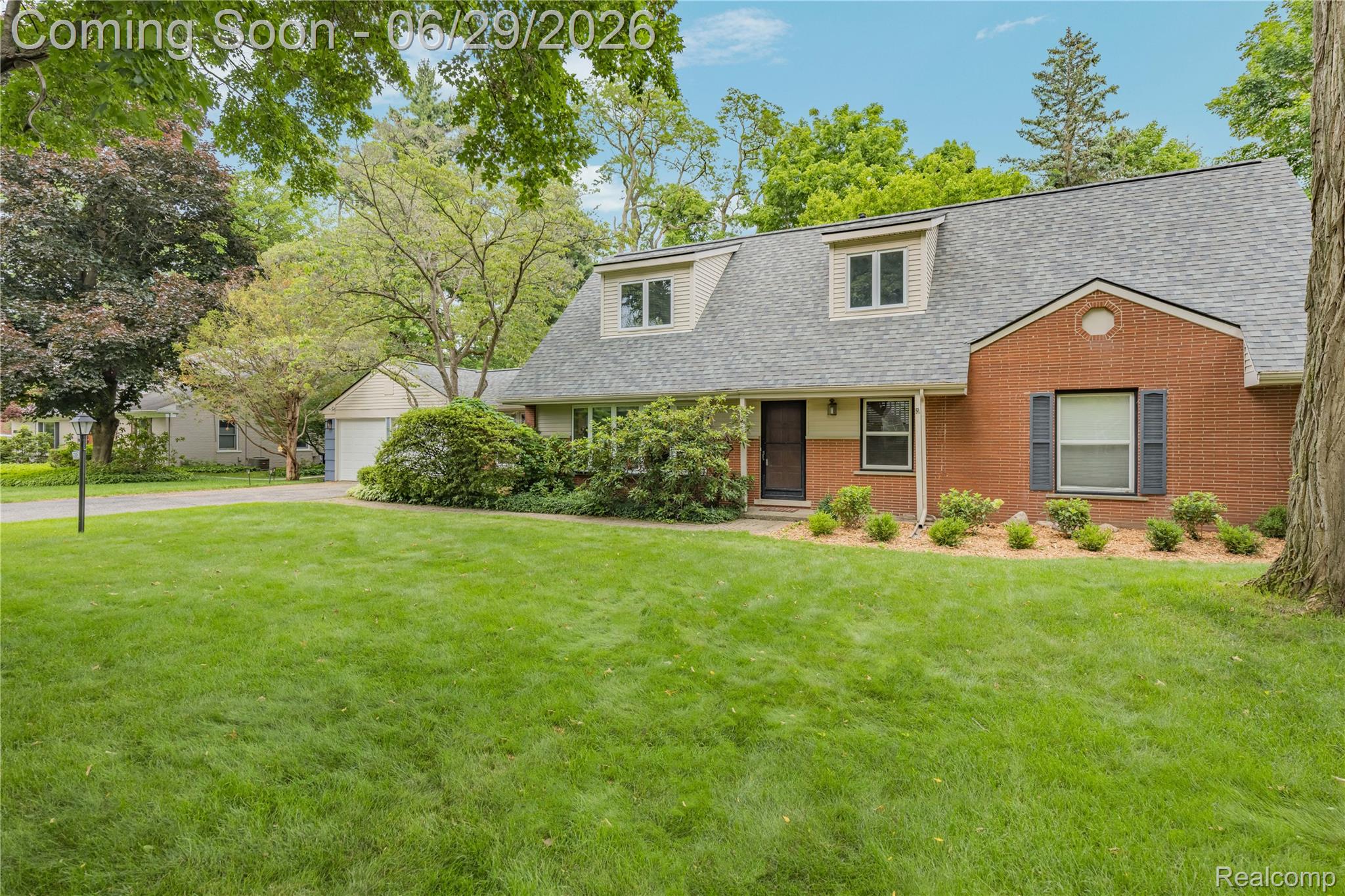 6085 Worlington Road Bloomfield Hills, MI 48301 - Photo 6 of 75 Brick and siding exterior with a shingle roof and dormer windows