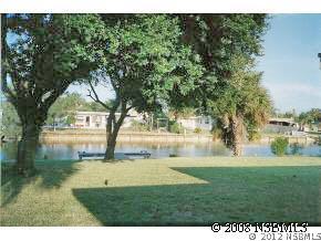107 Boca Ciega Road Cocoa Beach, FL 32931 - Photo 2 of 2 a view of garden with trees