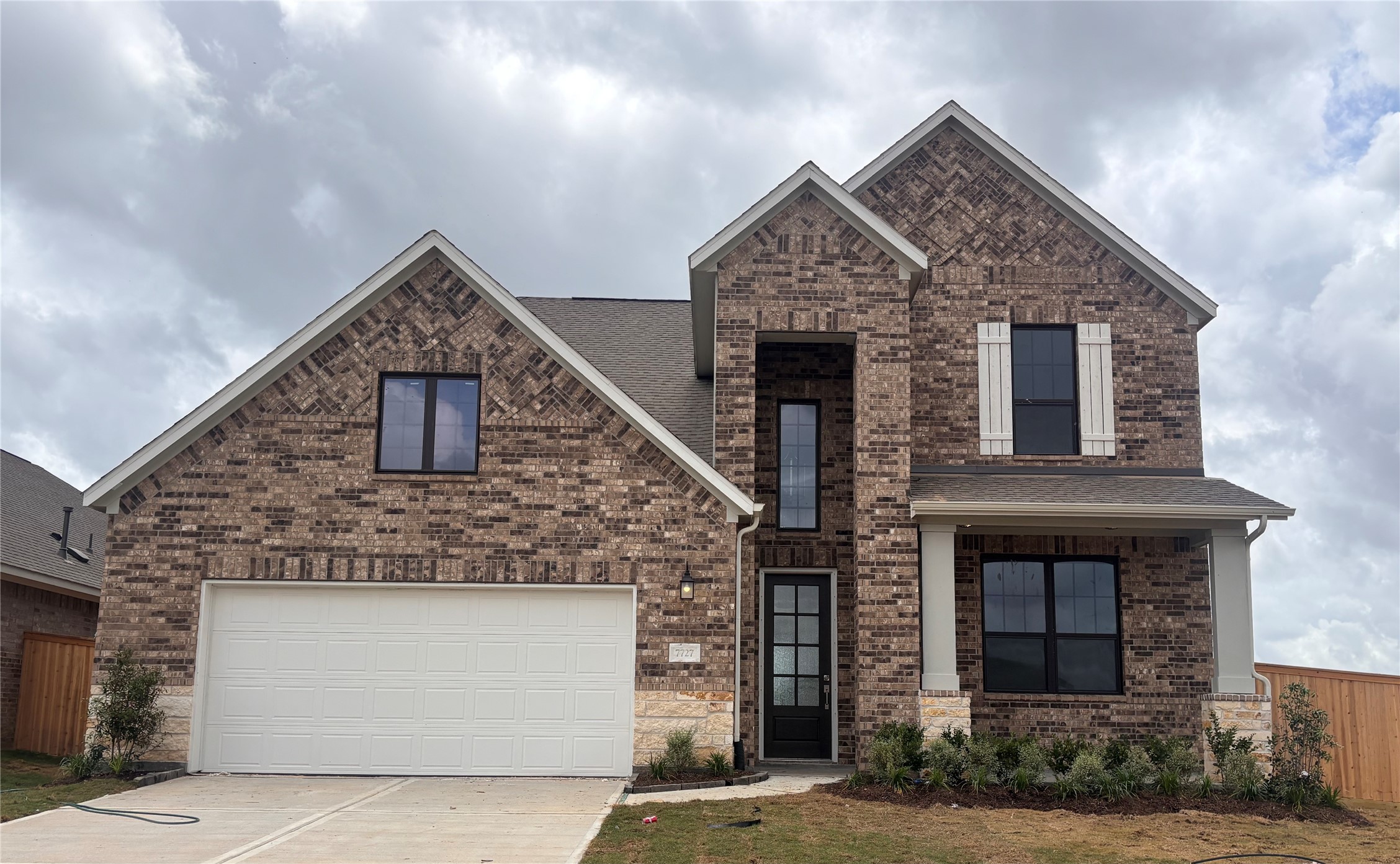 7727 Jade Crst Drive Angleton, TX 77515 - Photo 5 of 20 a front view of a house with garden