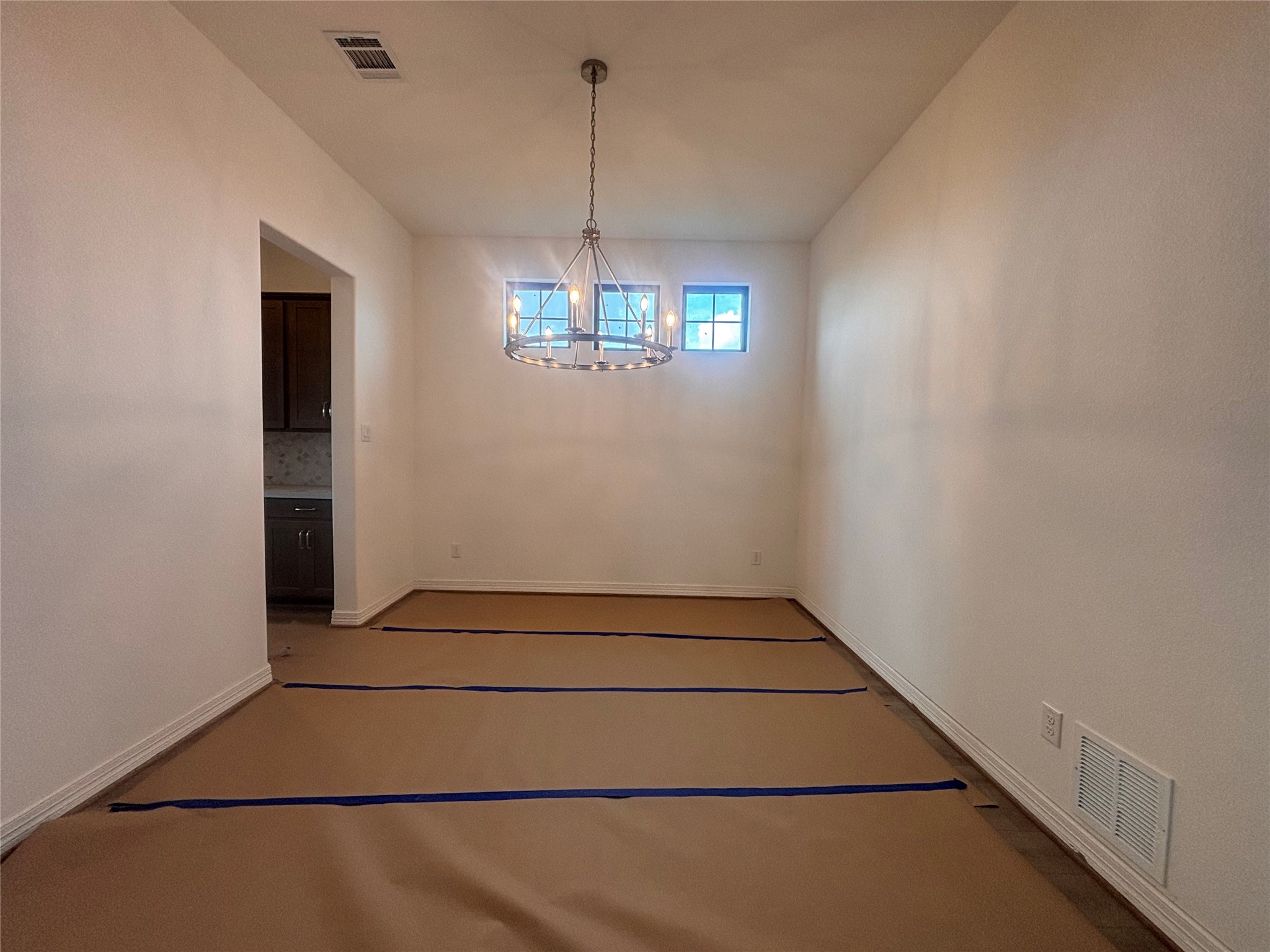 7727 Jade Crst Drive Angleton, TX 77515 - Photo 9 of 20 an empty room with chandelier fan and windows