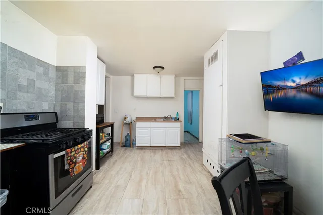 a kitchen with granite countertop a stove and a refrigerator