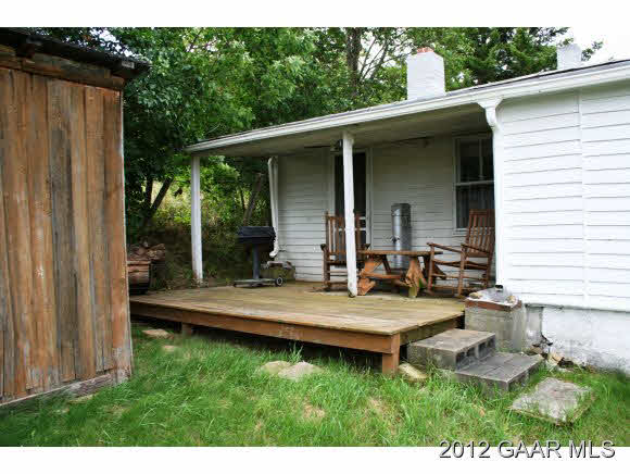 4966 Maple Sugar Road Blue Grass, VA 24413 - Photo 4 of 22 a view of house with backyard and outdoor seating