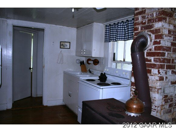 4966 Maple Sugar Road Blue Grass, VA 24413 - Photo 9 of 22 a kitchen with a sink and a stove