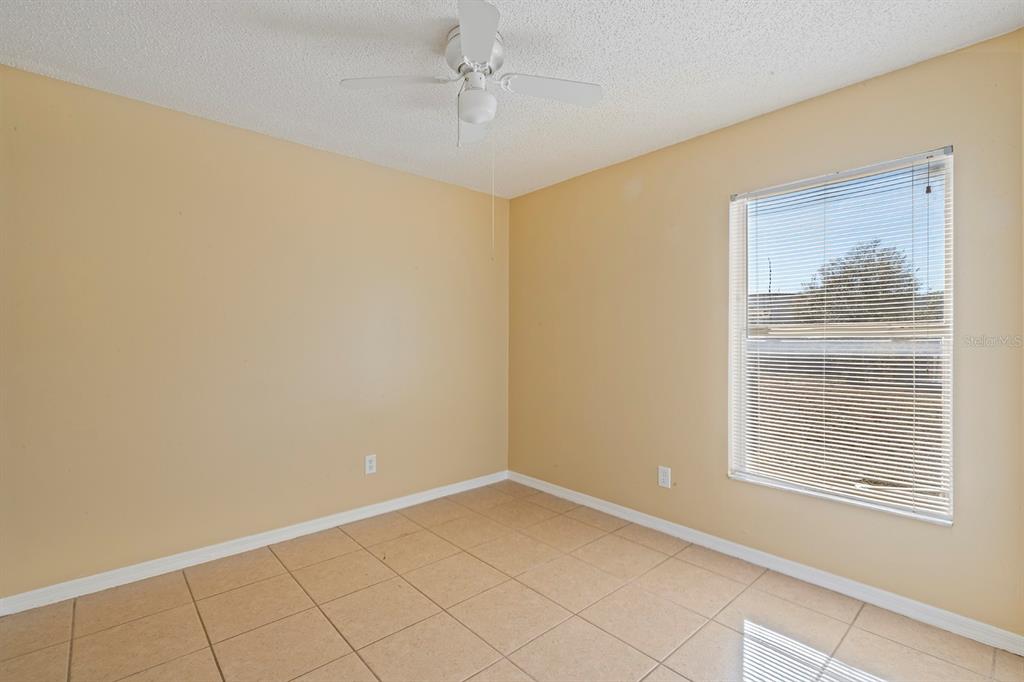 1533 Sunset View Circle Apopka, FL 32703 - Photo 16 of 23 a view of an empty room with a window