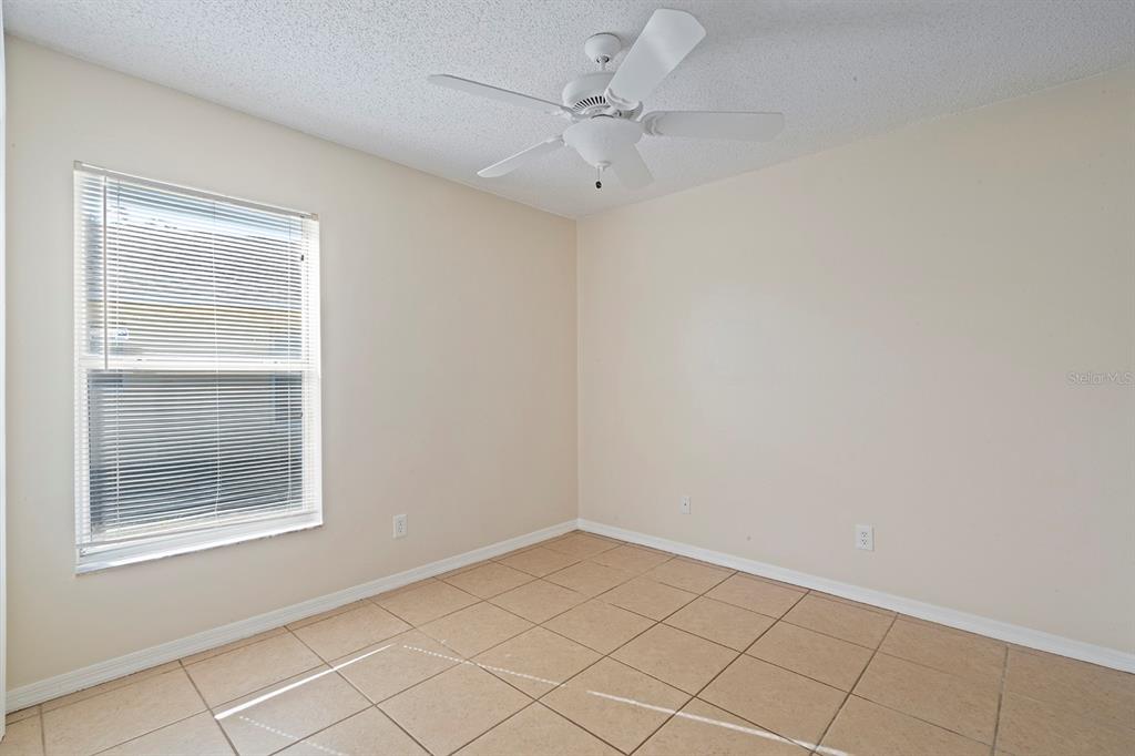 1533 Sunset View Circle Apopka, FL 32703 - Photo 17 of 23 a view of an empty room with a window