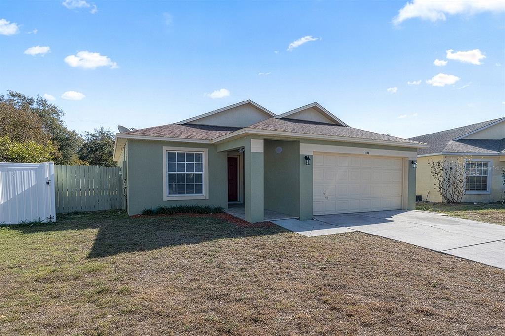 1533 Sunset View Circle Apopka, FL 32703 - Photo 2 of 23 a front view of a house with a yard and garage