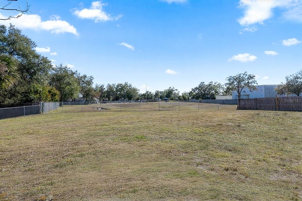 1533 Sunset View Circle Apopka, FL 32703 - Photo 21 of 23 a view of a yard with a house in the background