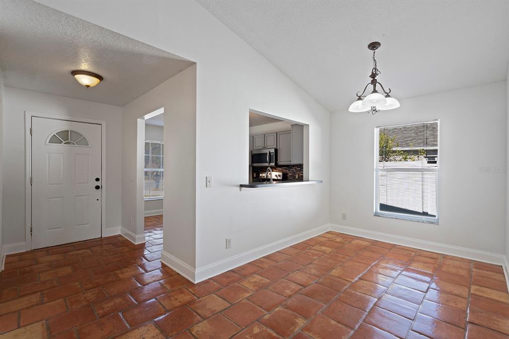 1533 Sunset View Circle Apopka, FL 32703 - Photo 3 of 23 a view of a room with wooden floor and windows
