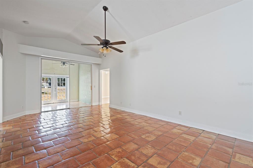 1533 Sunset View Circle Apopka, FL 32703 - Photo 4 of 23 a view of an empty room with window and chandelier fan