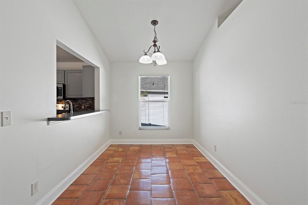 1533 Sunset View Circle Apopka, FL 32703 - Photo 8 of 23 a view of a hallway view with wooden floor and a window