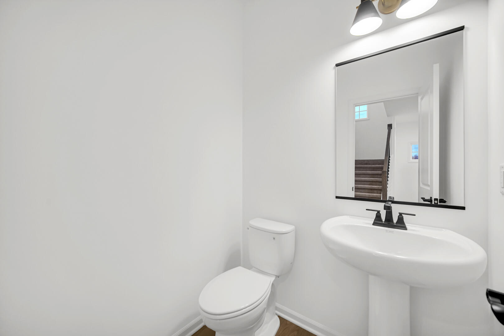 716 Verdano Terrace Crown Point, IN 46307 - Photo 13 of 26 a bathroom with a toilet a sink and mirror