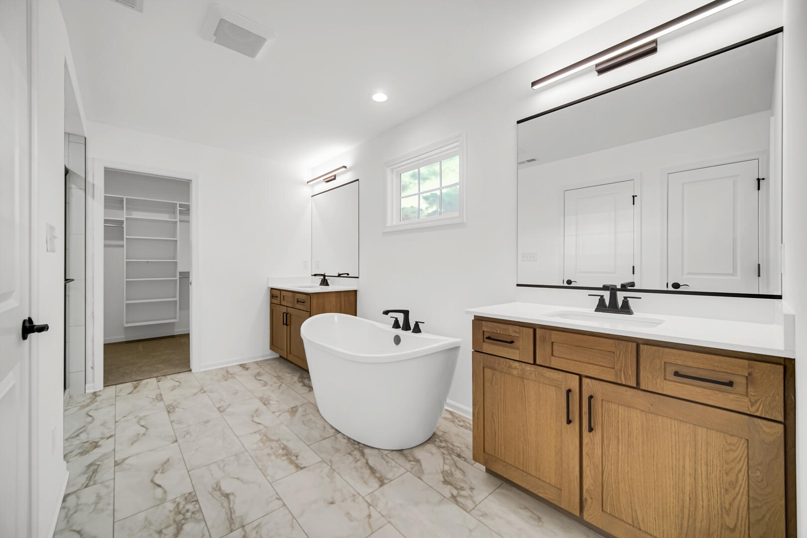716 Verdano Terrace Crown Point, IN 46307 - Photo 16 of 26 a bathroom with a sink and mirror