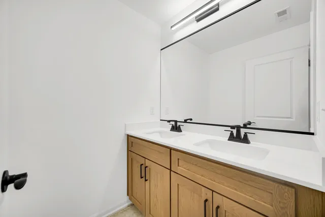a bathroom with a sink and mirror
