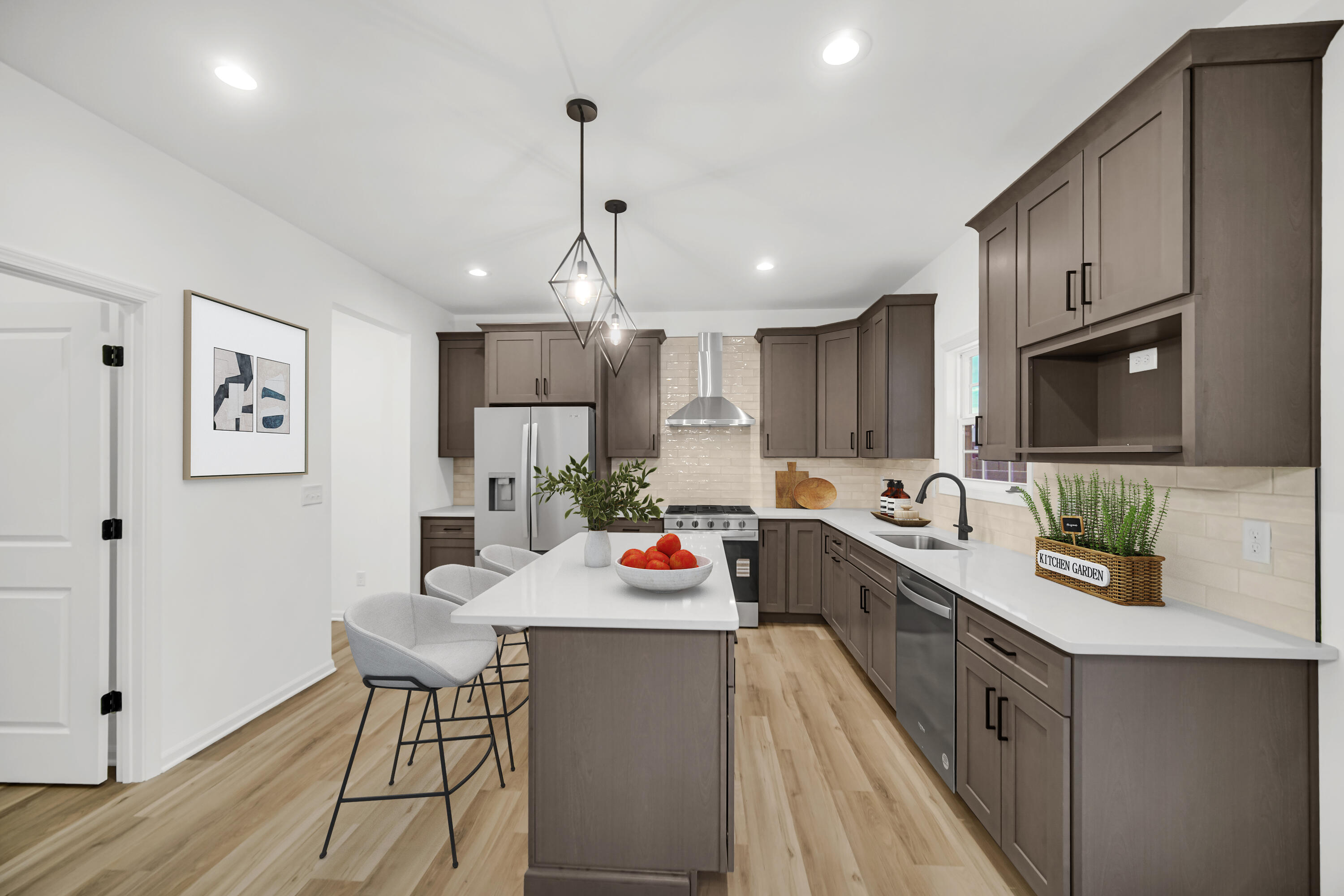 716 Verdano Terrace Crown Point, IN 46307 - Photo 5 of 26 a large kitchen with stainless steel appliances kitchen island granite countertop a sink dishwasher a stove and a refrigerator with wooden floor