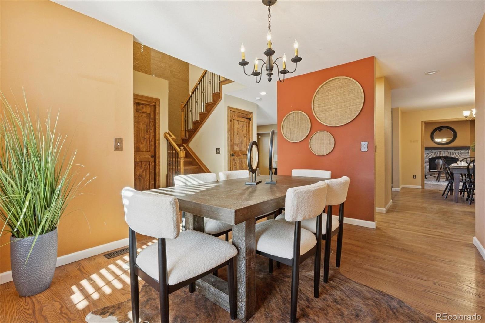 3779 Pasture Gate Circle Elizabeth, CO 80107 - Photo 16 of 49 a view of a dining room with furniture and wooden floor