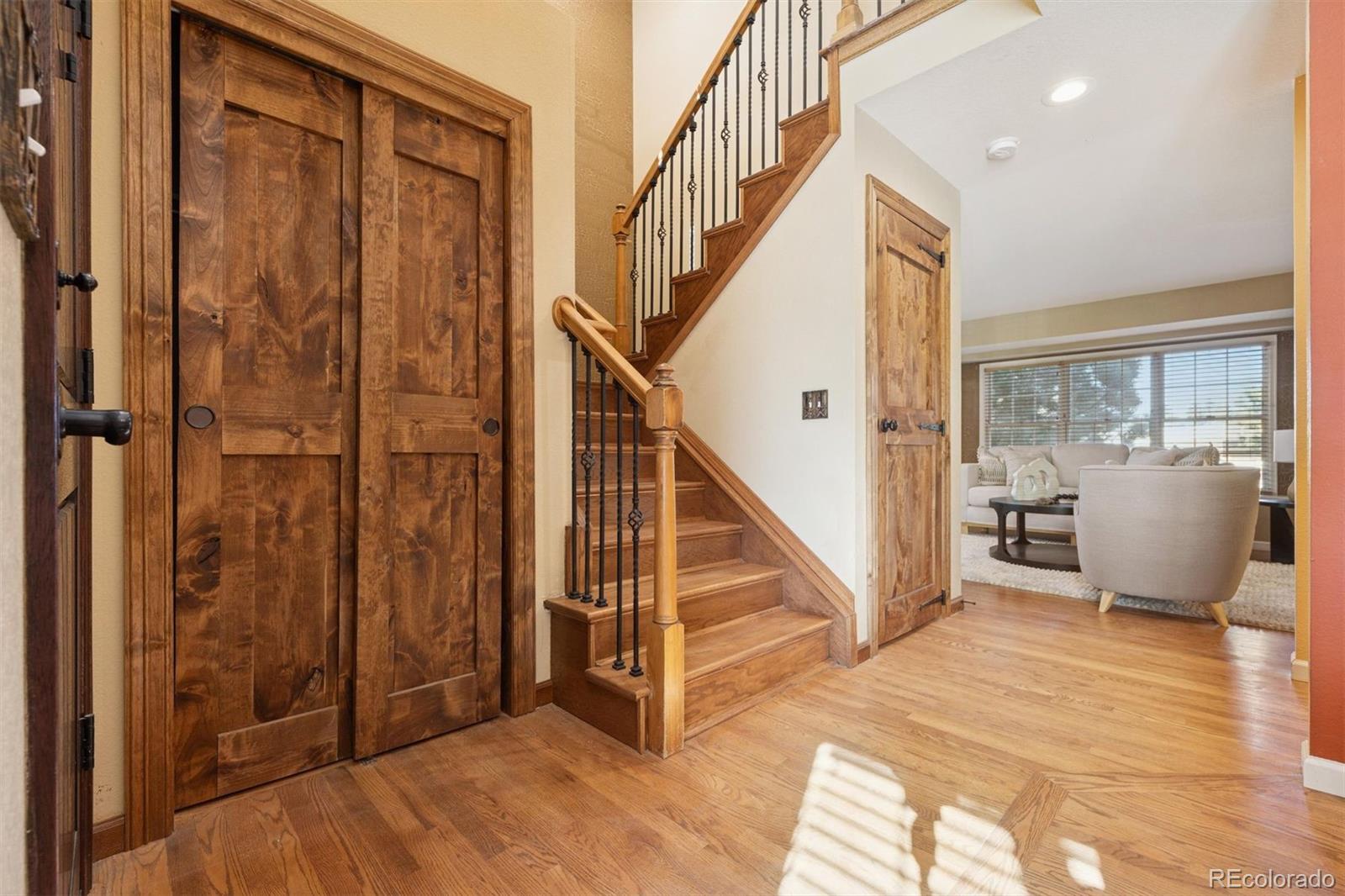 3779 Pasture Gate Circle Elizabeth, CO 80107 - Photo 18 of 49 a view of a livingroom with an entryway and staircase