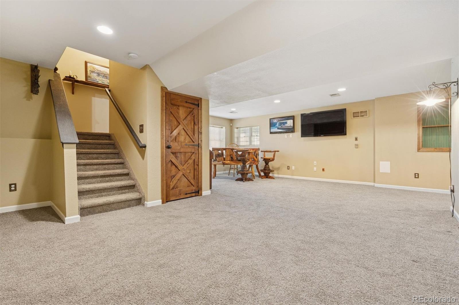 3779 Pasture Gate Circle Elizabeth, CO 80107 - Photo 46 of 49 a view of a livingroom with furniture and a flat screen tv