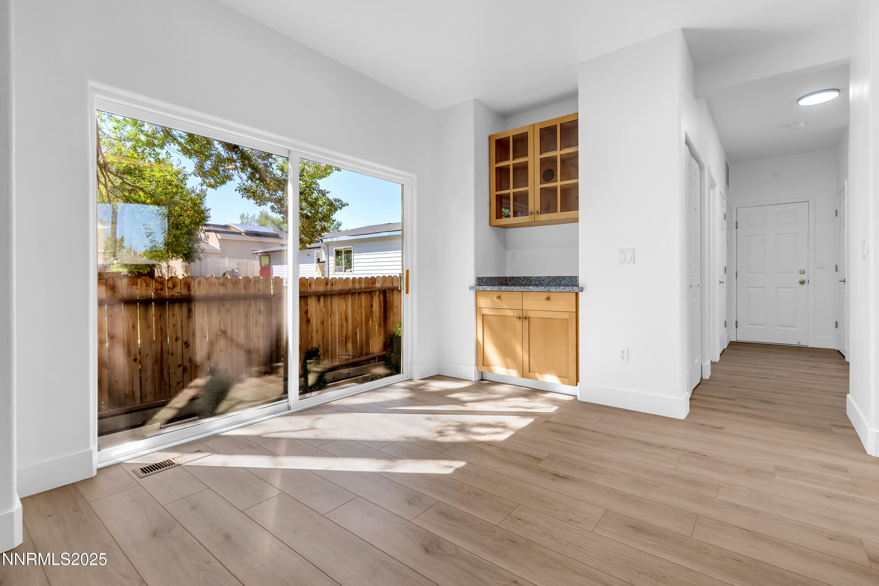 520 Warren Court Reno, NV 89509 - Photo 15 of 42 a view of empty room with wooden floor and fan