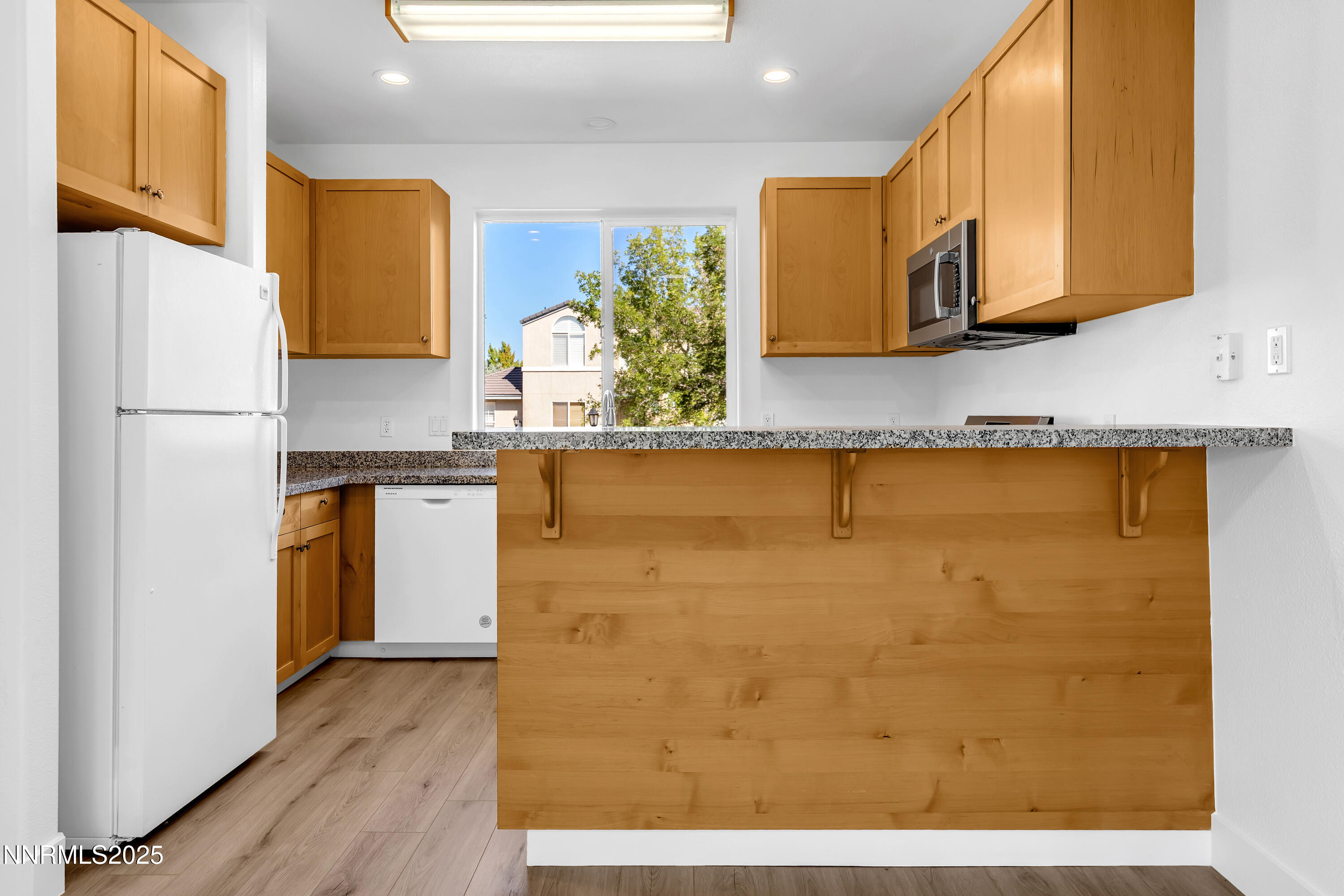 520 Warren Court Reno, NV 89509 - Photo 8 of 42 a kitchen with stainless steel appliances granite countertop a refrigerator a stove top oven and a sink