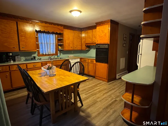 a living room with furniture and a book shelf