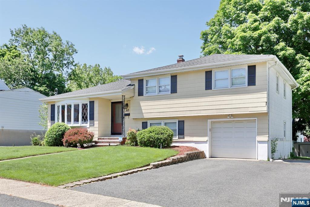 30 Brookfield Road Dumont, NJ 07628 - Photo 50 of 50 a front view of a house with garden
