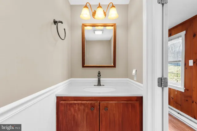 a sink sitting next to a window