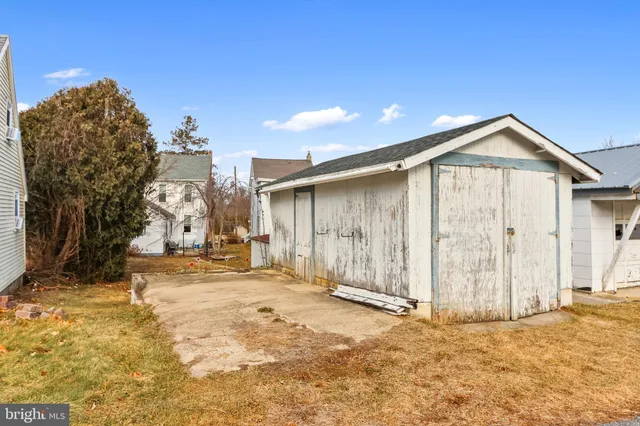 a view of a house with a snow in the background