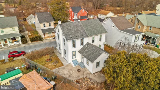 aerial view of a house with large trees