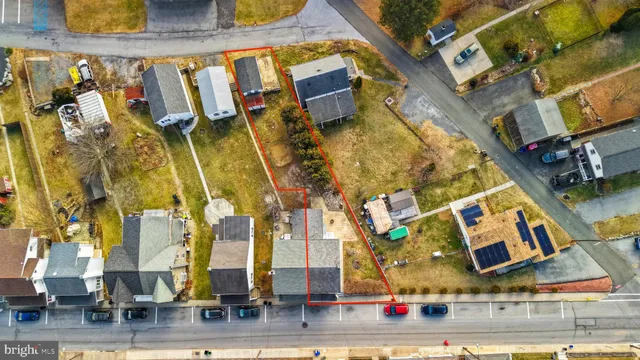 an aerial view of residential building and parking space
