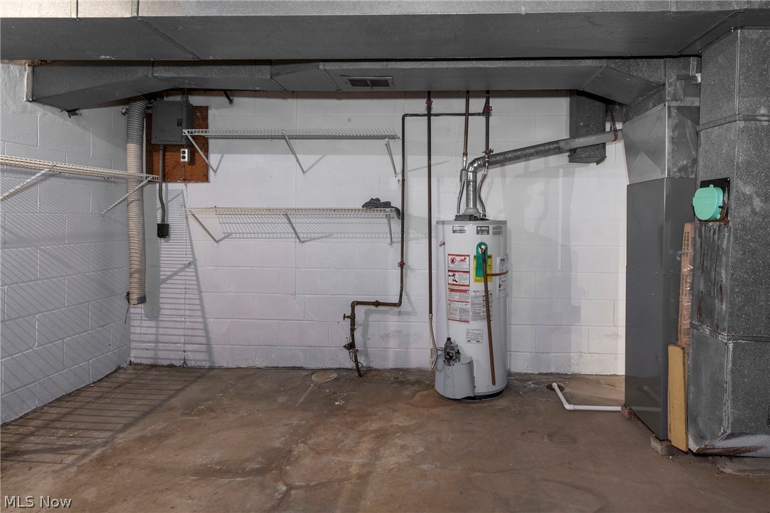 6484 State Road Parma, OH 44134 - Photo 32 of 36 Utility area with a hot-water tank and furnace.