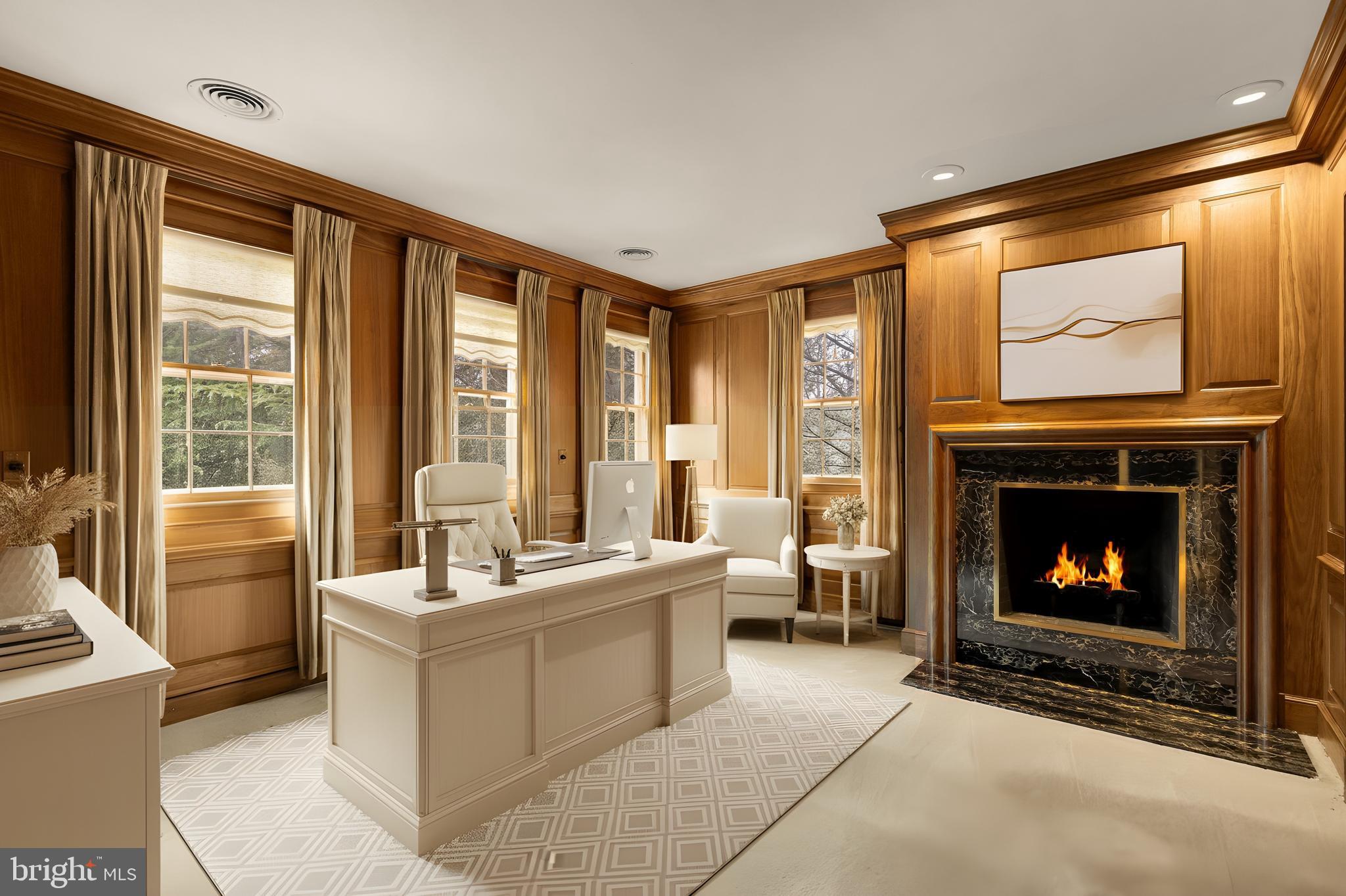 221 Chain Bridge Road McLean, VA 22101 - Photo 11 of 18 a living room with furniture a flat screen tv and a fireplace